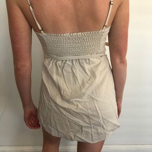 Adorable cut out beige wrap dress